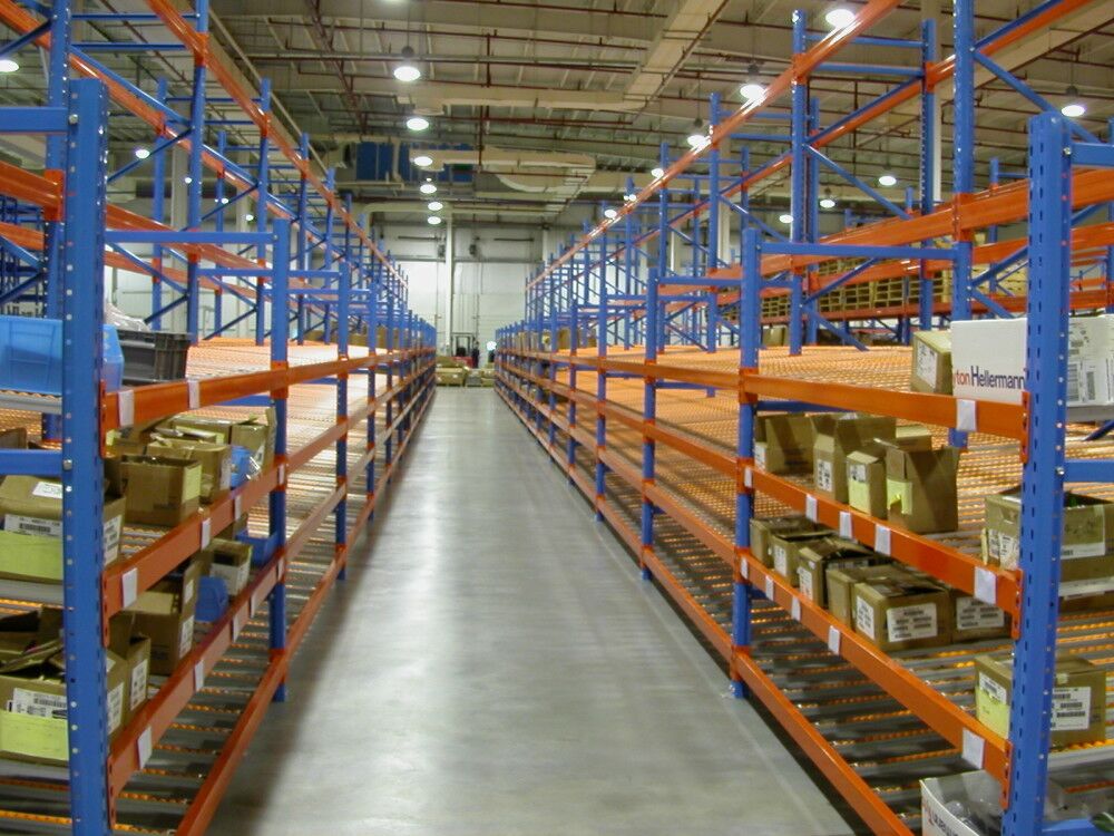 What are the benefits of using carton flow racks in a warehouse?